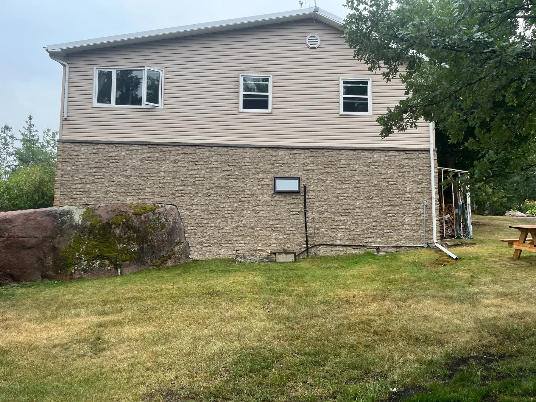 Side elevation of a Whiteshell cabin showing the completed exterior siding installation