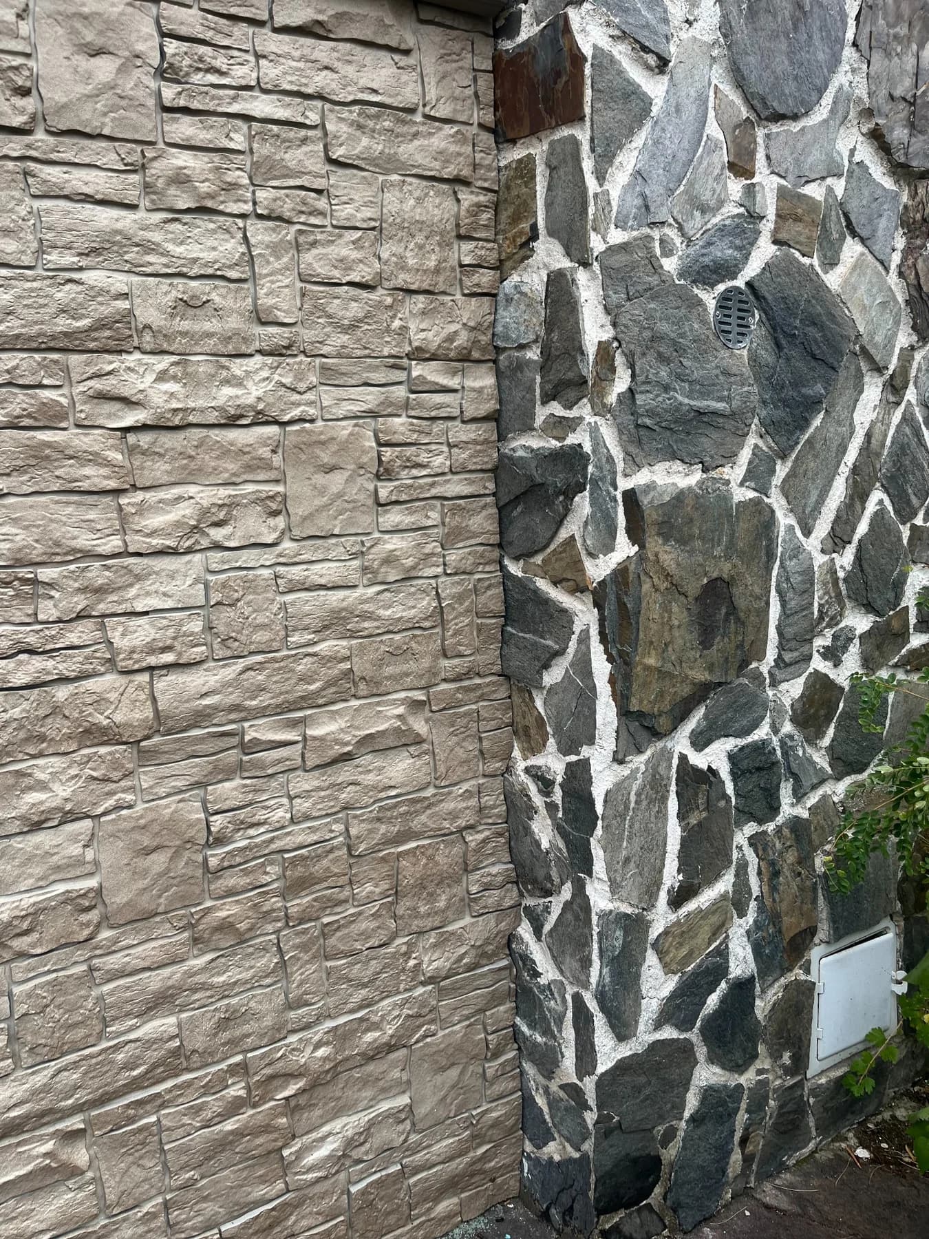 Close-up detail of exterior cladding finished neatly against the existing stone chimney